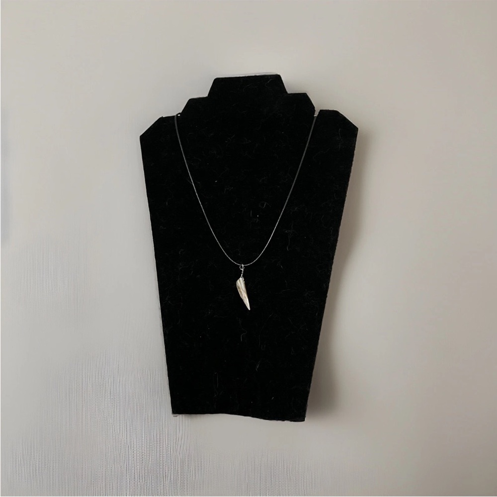 Shell Pendant On Black Leather Cord.